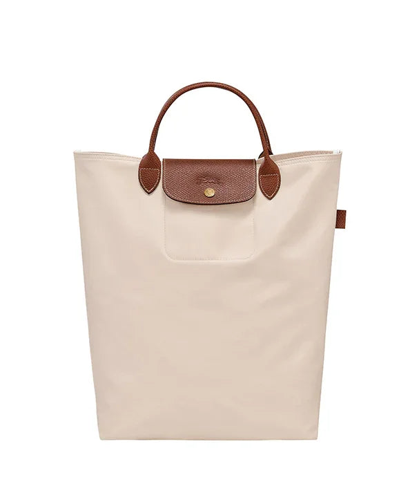 תיק יד אופנתי בצבע בז' עם ידיות ועיטורים חומים, נוכח באתר CHOZEN מותגים מובילים