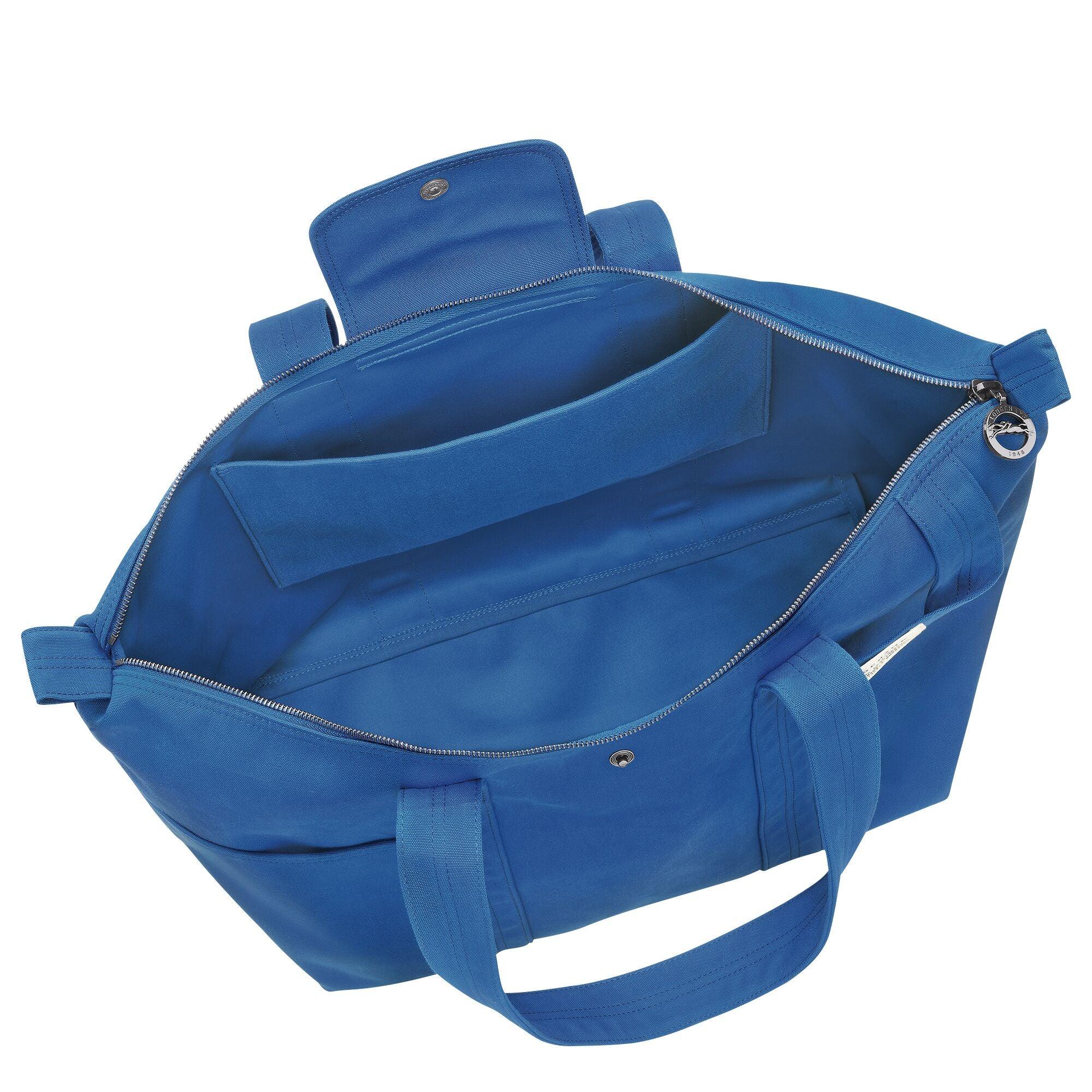 תיק יד כחול עם חלוקה פנימית ורוכסן, מוצג באתר CHOZEN מבית קבוצת אלפא