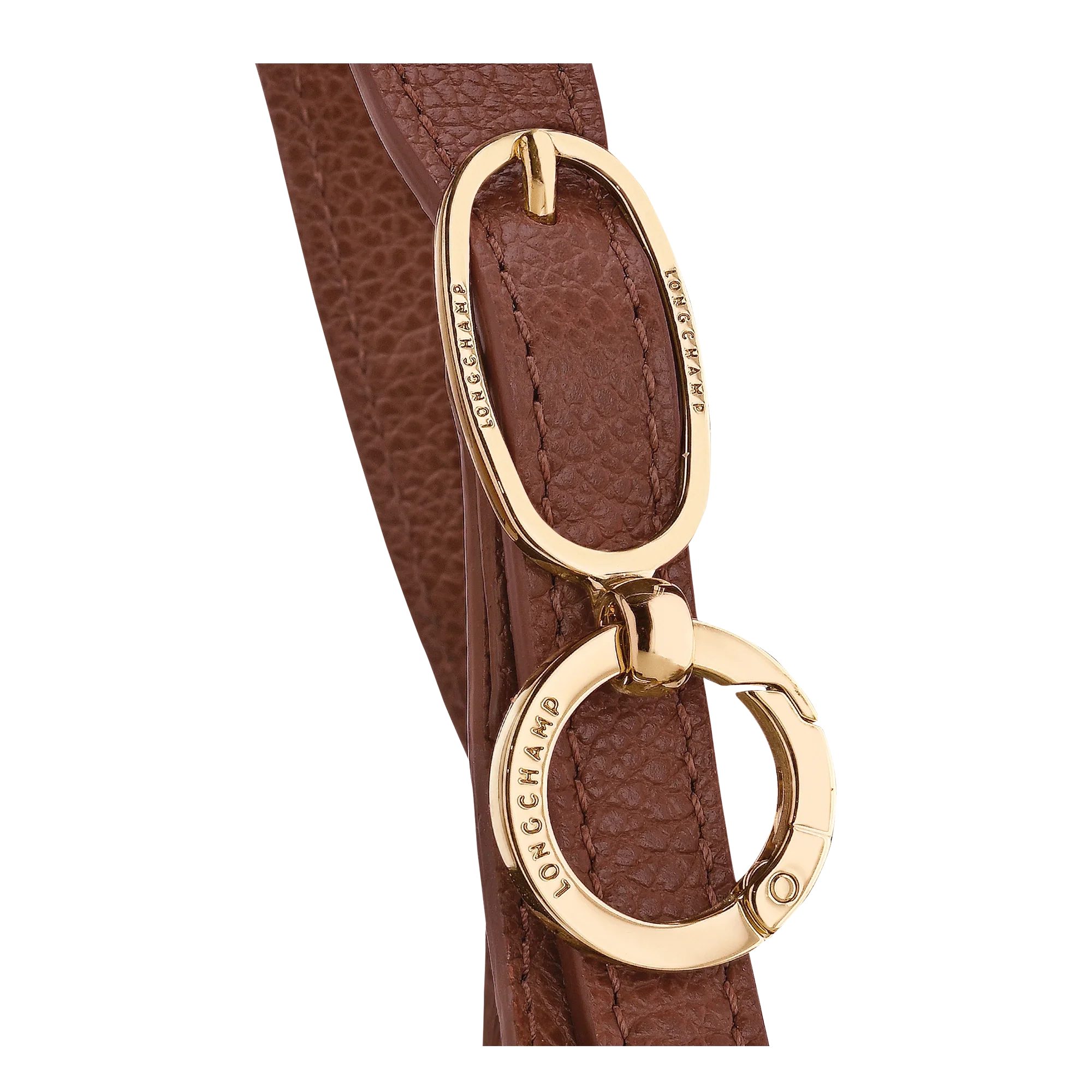 קלוז-אפ של אבזם זהב למותג LONGCHAMP על תיק עור חום, פריט יוקרה באתר CHOZEN