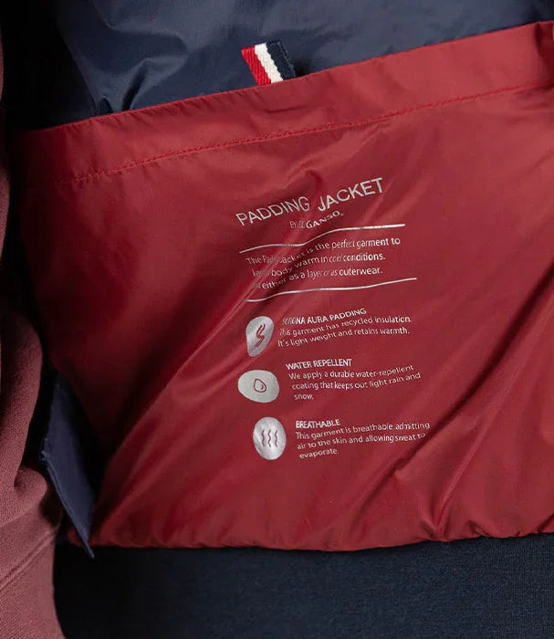 בטנת מעיל PADDING JACKET באדום עם תווית הסבר באנגלית מחנות CHOZEN, עמיד למים ונושם
