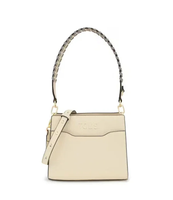 תיק יד נשי בעיצוב אלגנטי בצבע בז' עם רצועה קלועה, מותג TOUS, מהיבואן הרשמי קבוצת אלפא