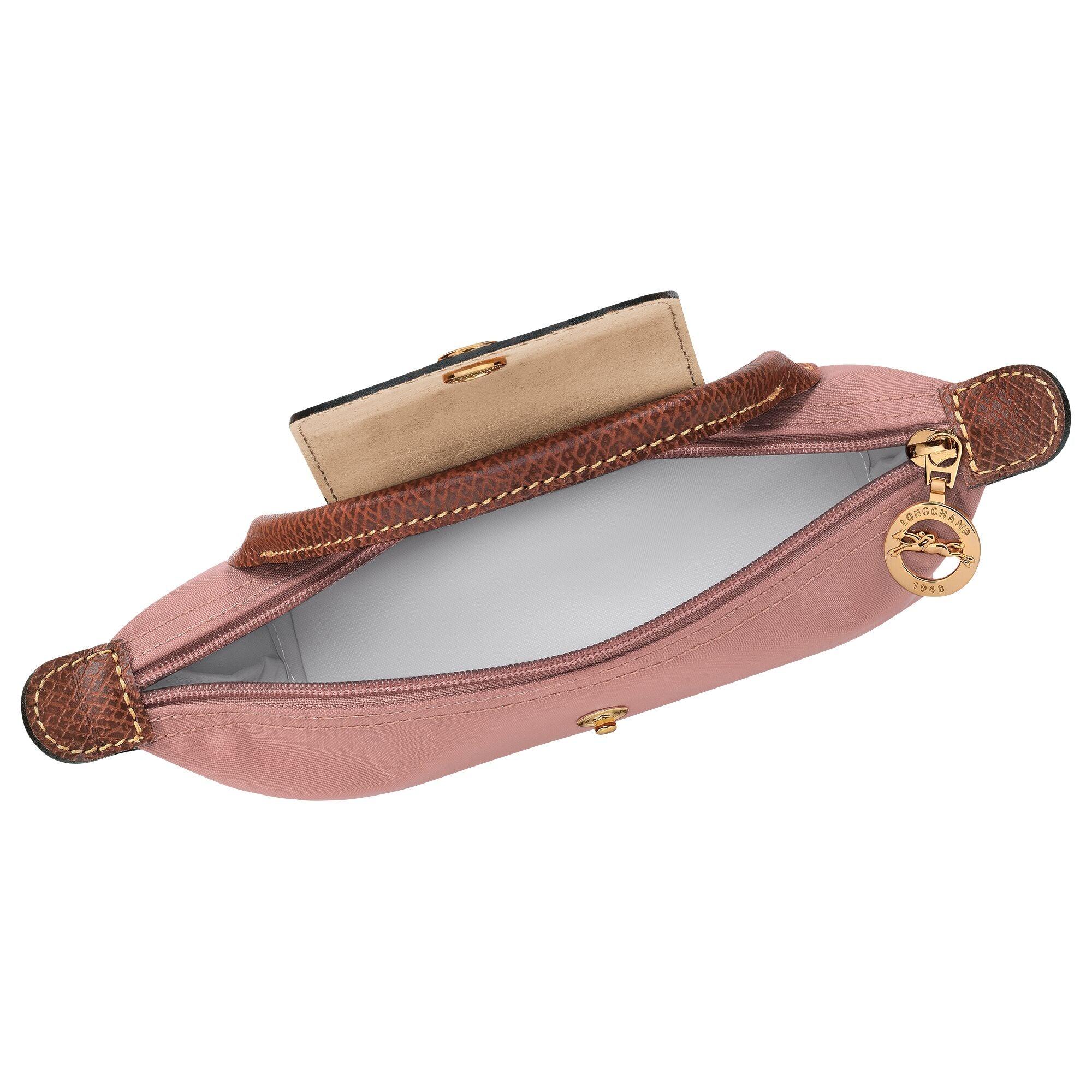 תיק יד ורוד עם פרטים חומים של LONGCHAMP, פתוח ומציג ריצ'רץ' וסמל זהב, גלו מותגים ב-CHOZEN