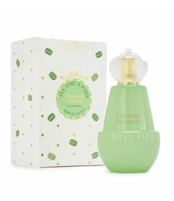בושם Macaron Amande בעיצוב ירוק ליד קופסה חגיגית, מוצר מהמותגים המובילים ב-CHOZEN