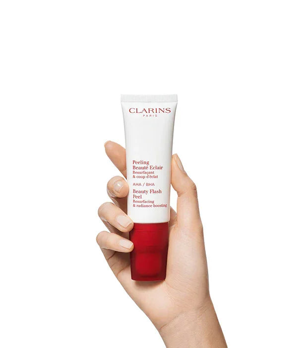 יד מחזיקה פילינג Clarins Beauty Flash Peel, מוצר טיפוח עור CHOZEN מותגים מובילים