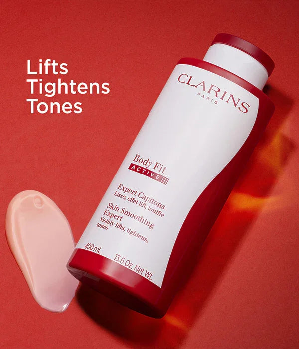 בקבוק קרם Clarins Body Fit Active על רקע אדום, מוצר טיפוח להחלקת וחיזוק עור, מותג יוקרה באתר CHOZEN