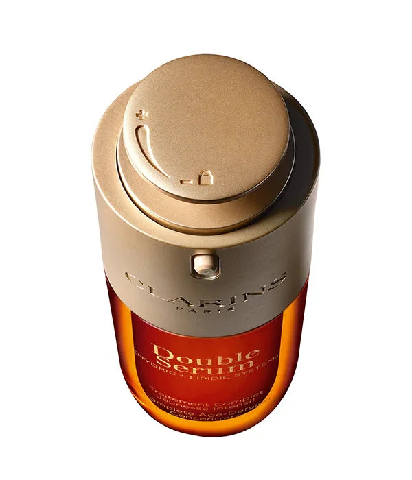 סרום לעור הפנים Double Serum מבית Clarins בצבע זהב וכתום, מוצר טיפוח יוקרתי ב-CHOZEN
