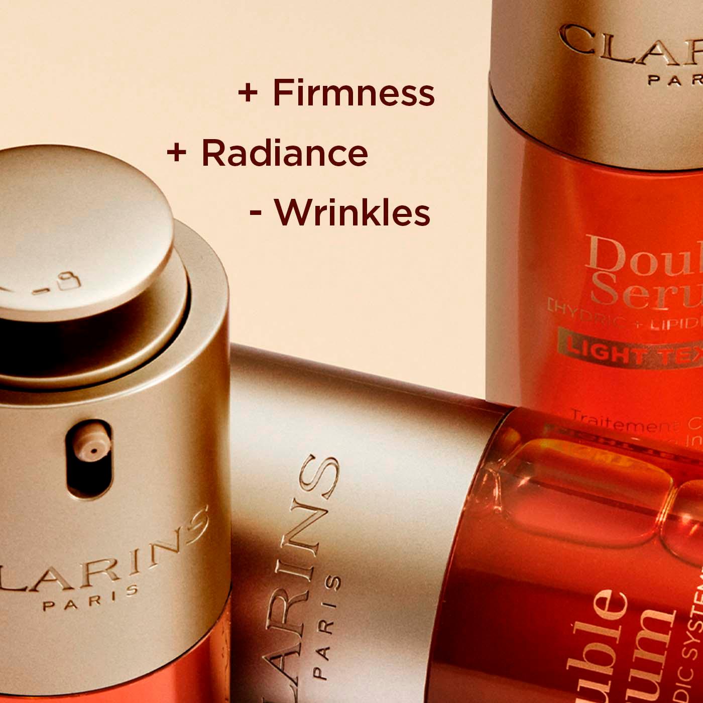 סרום Double Serum של Clarins, מוצר טיפוח עור יוקרתי בעיצוב זהב כתום, HOMEPAGE CHOZEN
