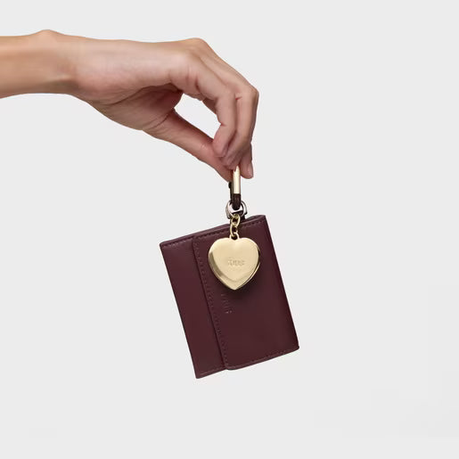 טואוס סט של תליונים Hold בצבעי זהב ובורדו