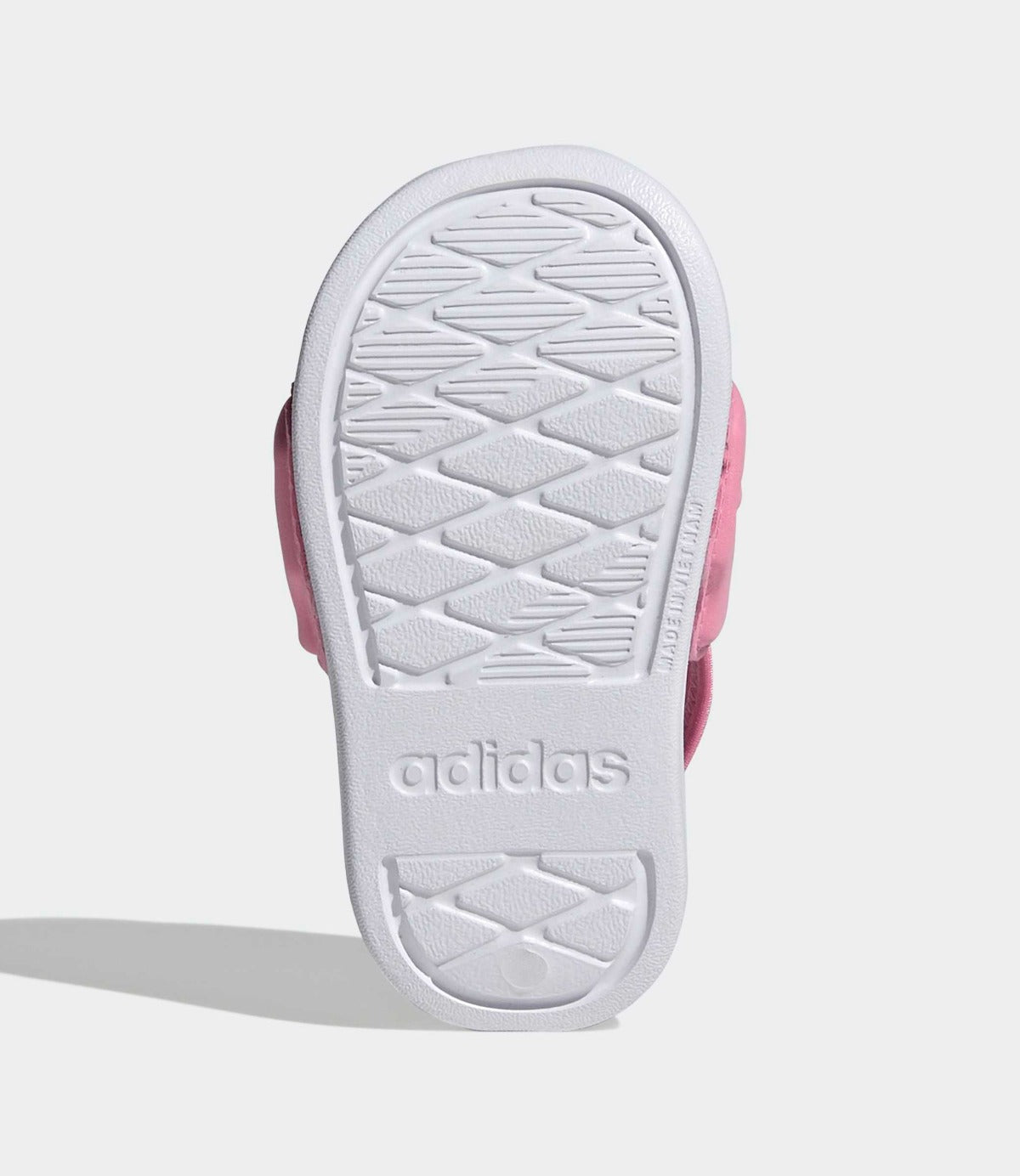 סוליית נעל ילדים ורודה עם תבליט לבן ודוגמת אחיזה ברורה