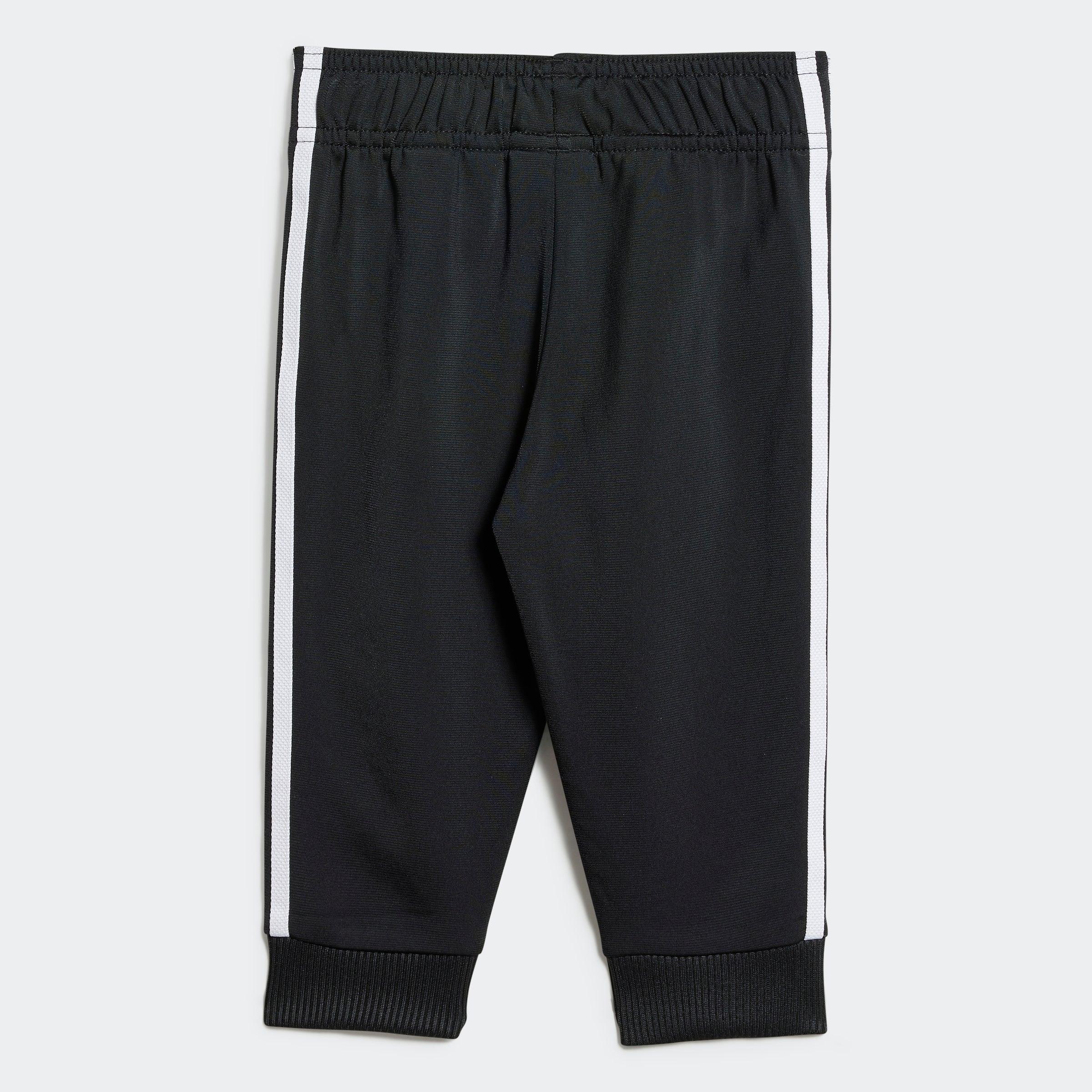 מכנסי ספורט שחורים עם פס לבן צידי, צילום אחורי, אופנה CHOZEN