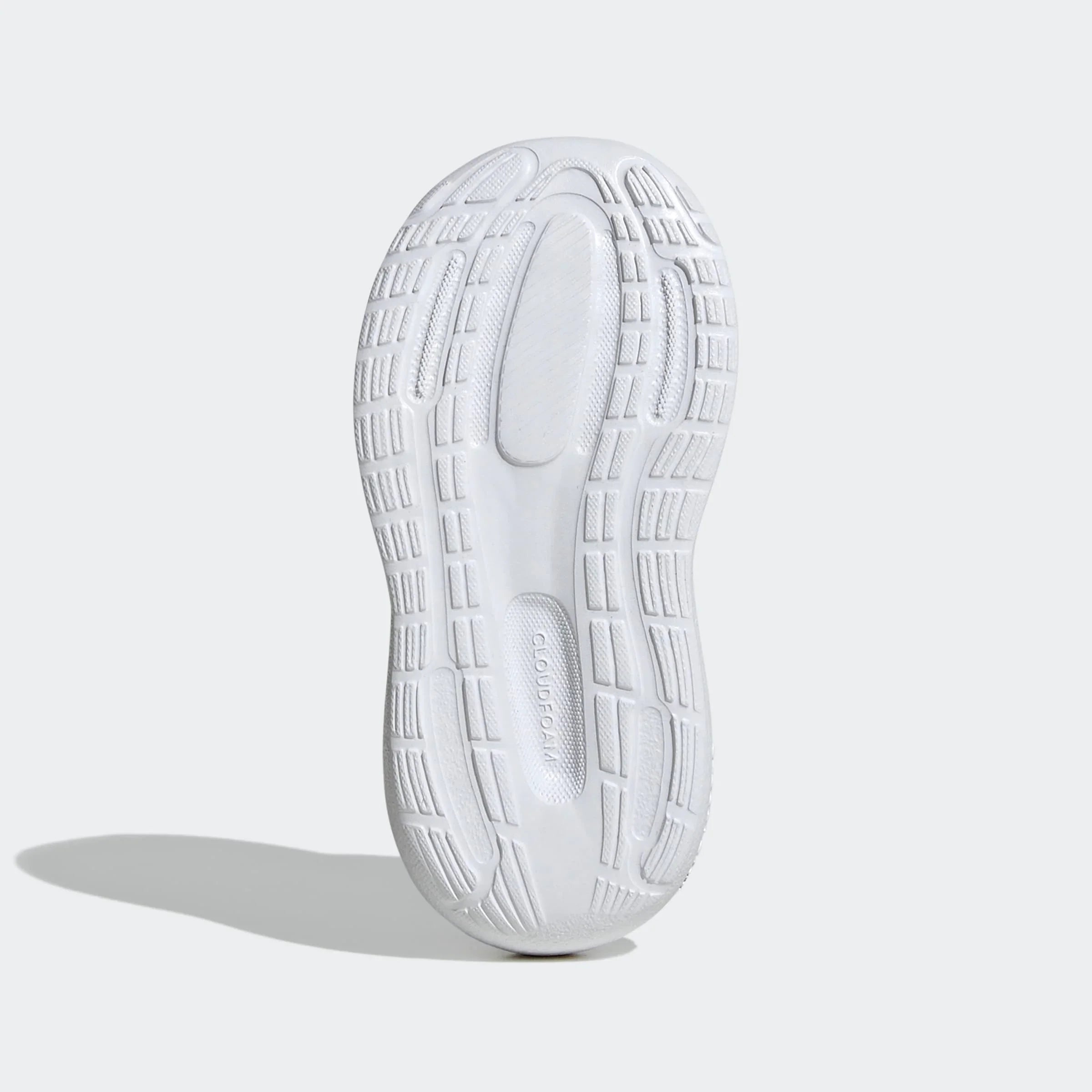 סוליית נעל ספורט לבנה, דגם נעלי ריצה, עם טקסטורת אחיזה בולטת וציון CLOUDFOAM