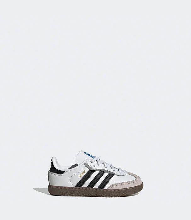 נעל סניקרס אדידס סאמבה לילדים, עור לבן עם פסים שחורים, על רקע אפור, CHOZEN