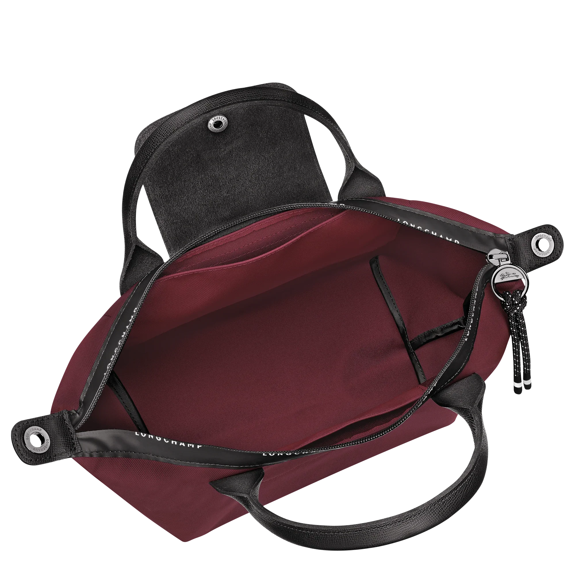 תיק יד לנשים מבית LONGCHAMP, צבע בורדו עם ידיות עור שחורות, מוצג בתצוגה פנימית