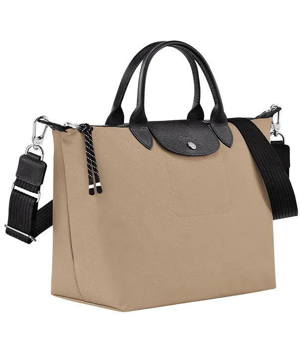 תיק יד אופנתי בצבע בז' עם ידיות ורצועה שחורות, קולקציית מותגים CHOZEN