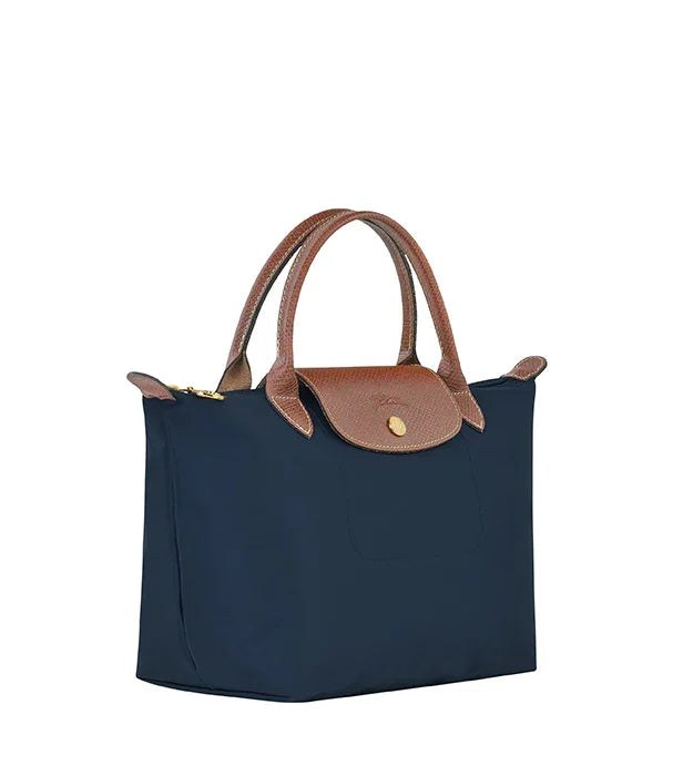 תיק יד אופנתי לנשים בצבע כחול כהה עם ידיות ועיטורי עור חום, מבית CHOZEN