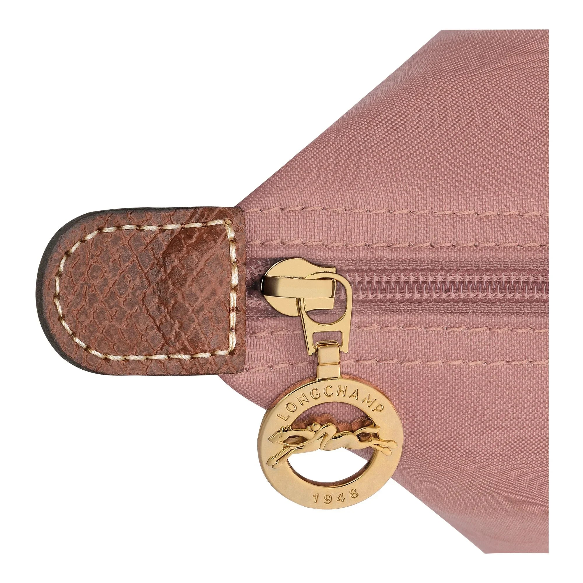רוכסן תיק ורוד מבית LONGCHAMP עם תג זהוב ממותג, קנט עור חום, מבית CHOZEN קבוצת אלפא