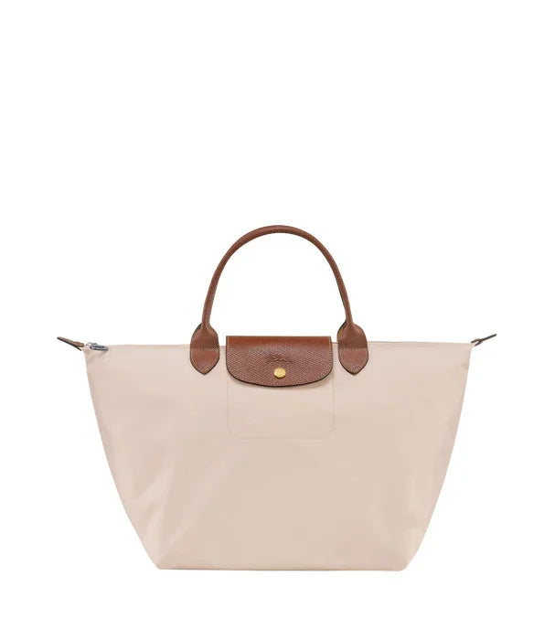 תיק יד אופנתי בז' עם ידיות ועיטורים חומים, מוצר יוקרה באתר CHOZEN