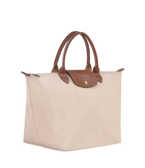 תיק יד לנשים מבד בגוון בז׳ עם ידיות ועיטורים חום, מותג יוקרה ב-CHOZEN