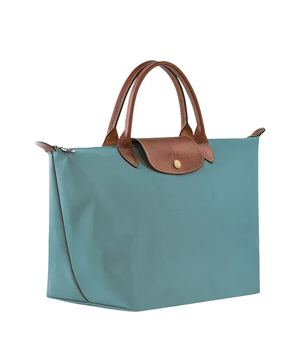 תיק יד אופנתי בצבע טורקיז עם ידיות עור חום, מבית מותג יוקרה ב-CHOZEN