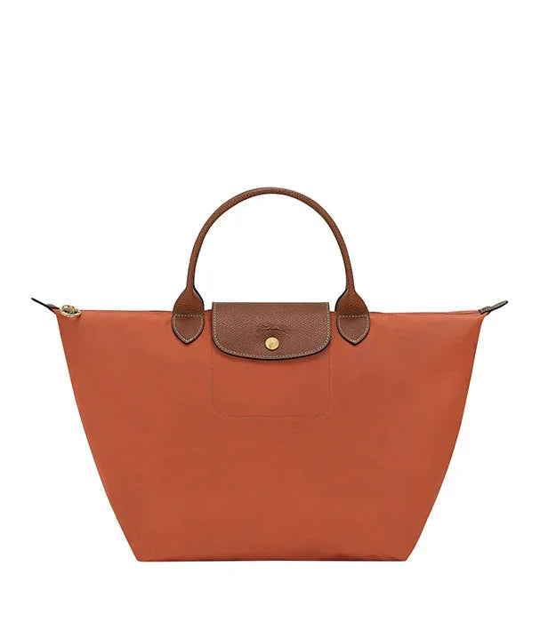 תיק יד כתום עם ידיות ועיטורים חומים מ-CHOZEN, תיק מותגים לנשים