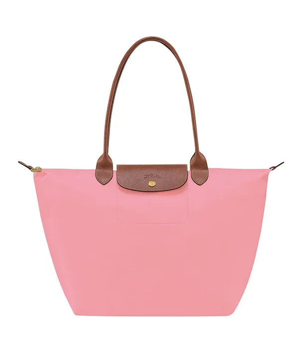 תיק יד ורוד עם ידיות חומות, עיצוב אופנתי, משווק ב-CHOZEN על ידי קבוצת אלפא