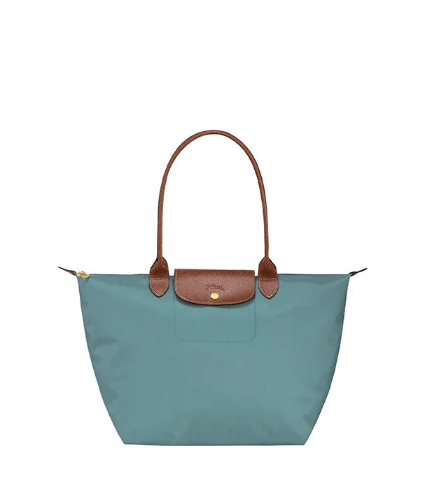 תיק יד מעוצב לנשים בירוק תכלת עם ידיות וסגירה מעור חום, מבית המותגים המובילים ב-CHOZEN