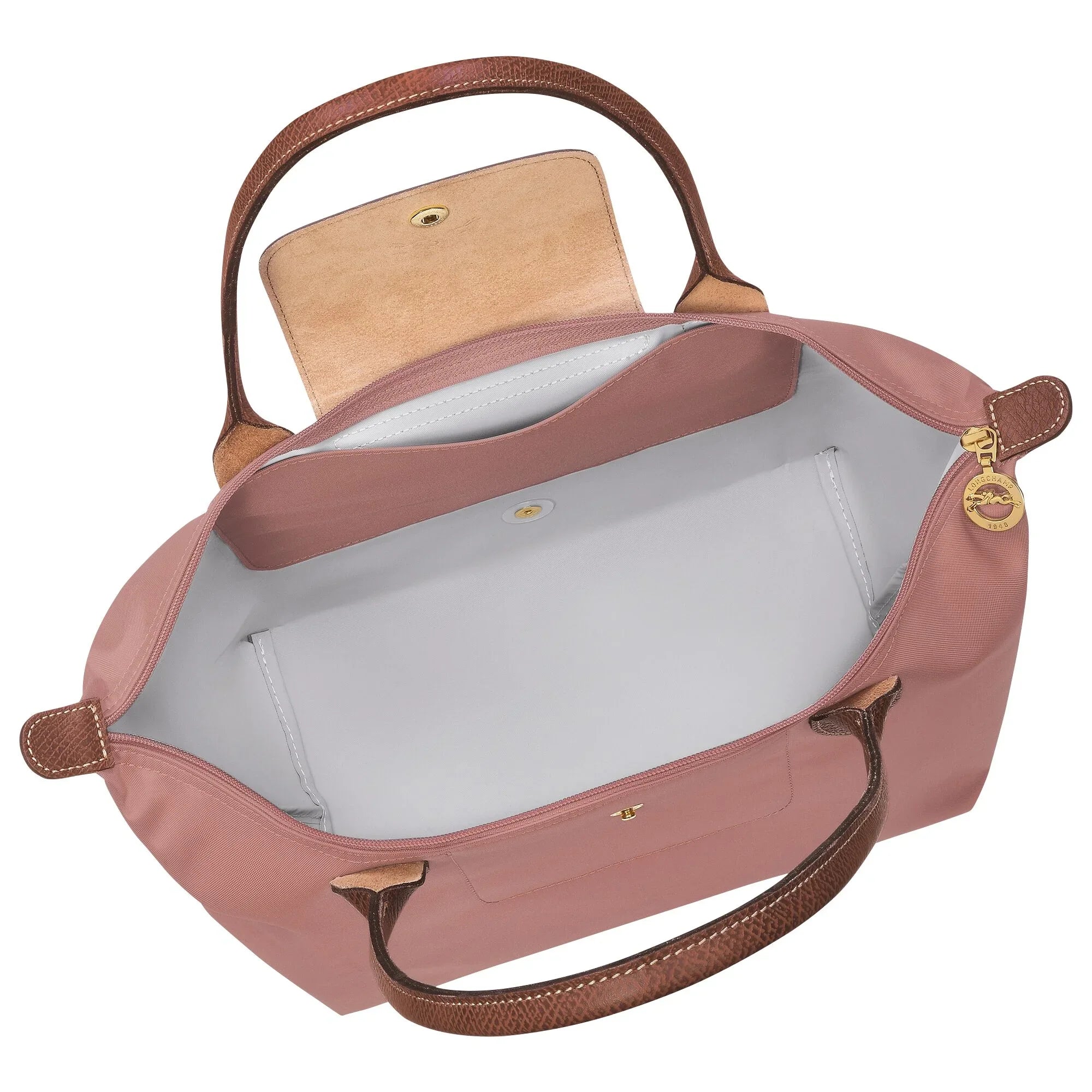 תיק יד ורוד קלאסי עם ידיות חומות, פתוח ומוצג מבפנים, ממותג יוקרה ב-CHOZEN