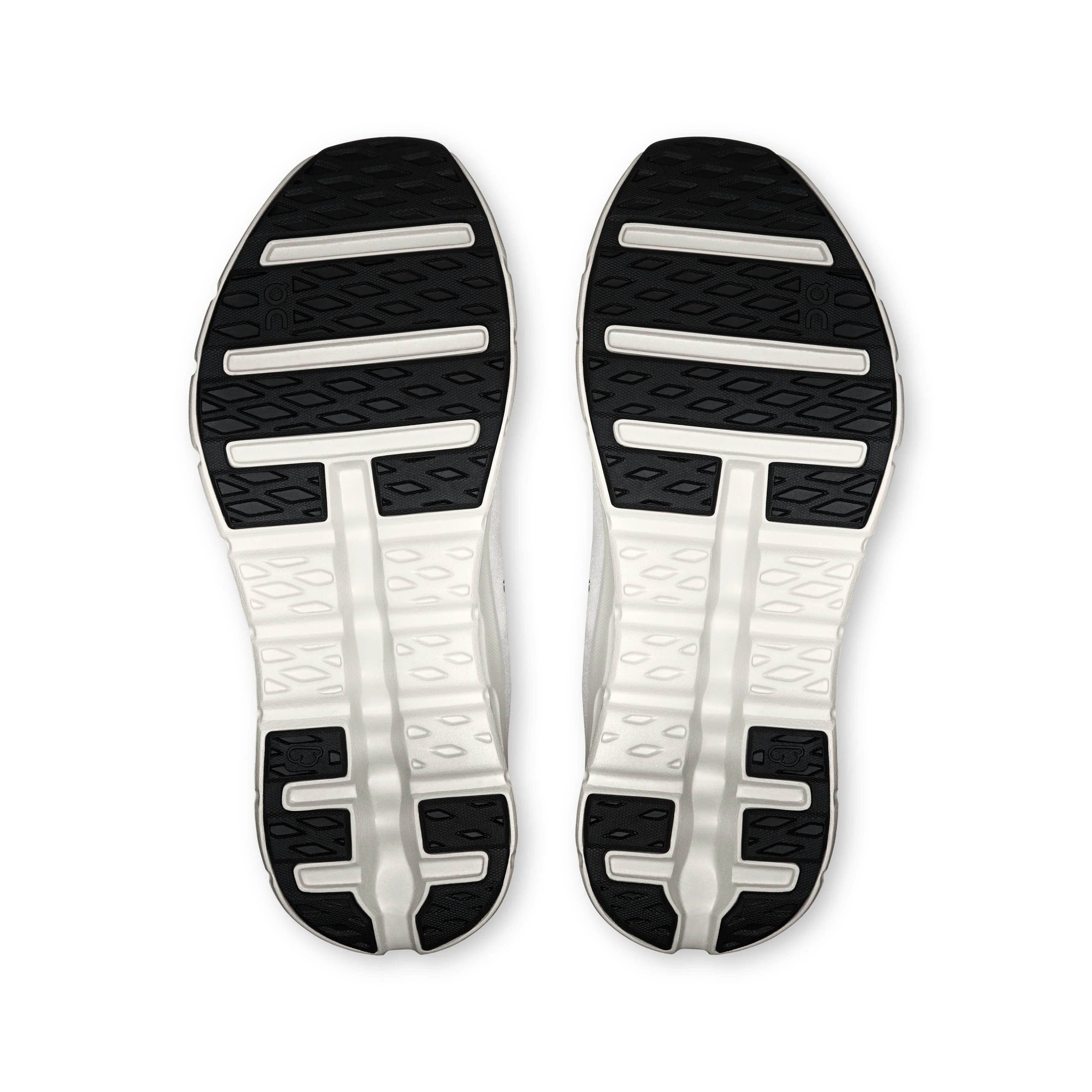 סוליות נעלי ספורט ריצה בצבע לבן עם אזורים שחורים, מבט תחתון, דוגמת אחיזה רחבה