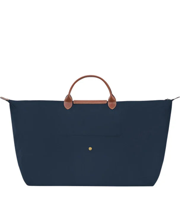 תיק נסיעות כחול עם ידיות עור חום, עיצוב יוקרתי, מותגים מובילים ב-CHOZEN