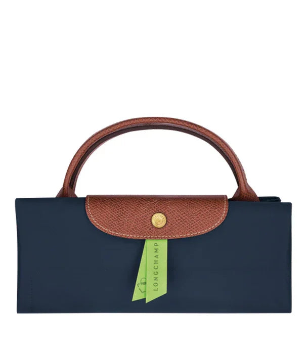 תיק יד נשים מתקפל של LONGCHAMP כחול עם ידית ועיטור חום, נמכר ב-CHOZEN קבוצת אלפא