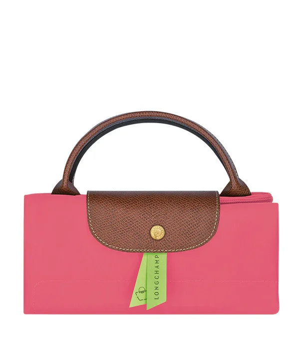 תיק נשי ורוד עם ידית ועיטור חום של LONGCHAMP, מבית היבואן הרשמי קבוצת אלפא