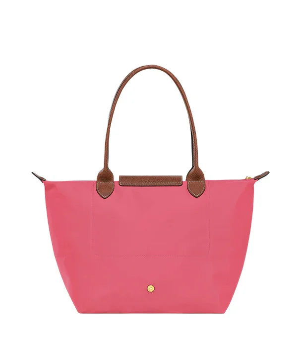 תיק יד ורוד עם ידיות עור חומות באתר CHOZEN, קולקציה לנשים מהמותגים המובילים