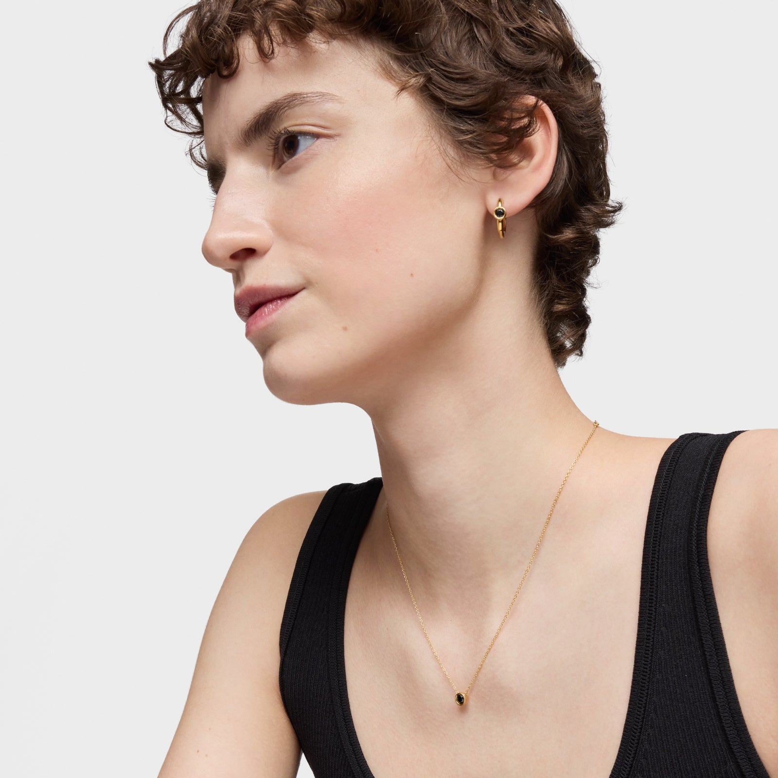 טואוס שרשרת בשיבוץ אבן ספינל שחורה Line מכסף ועליו זהב 18 קראט