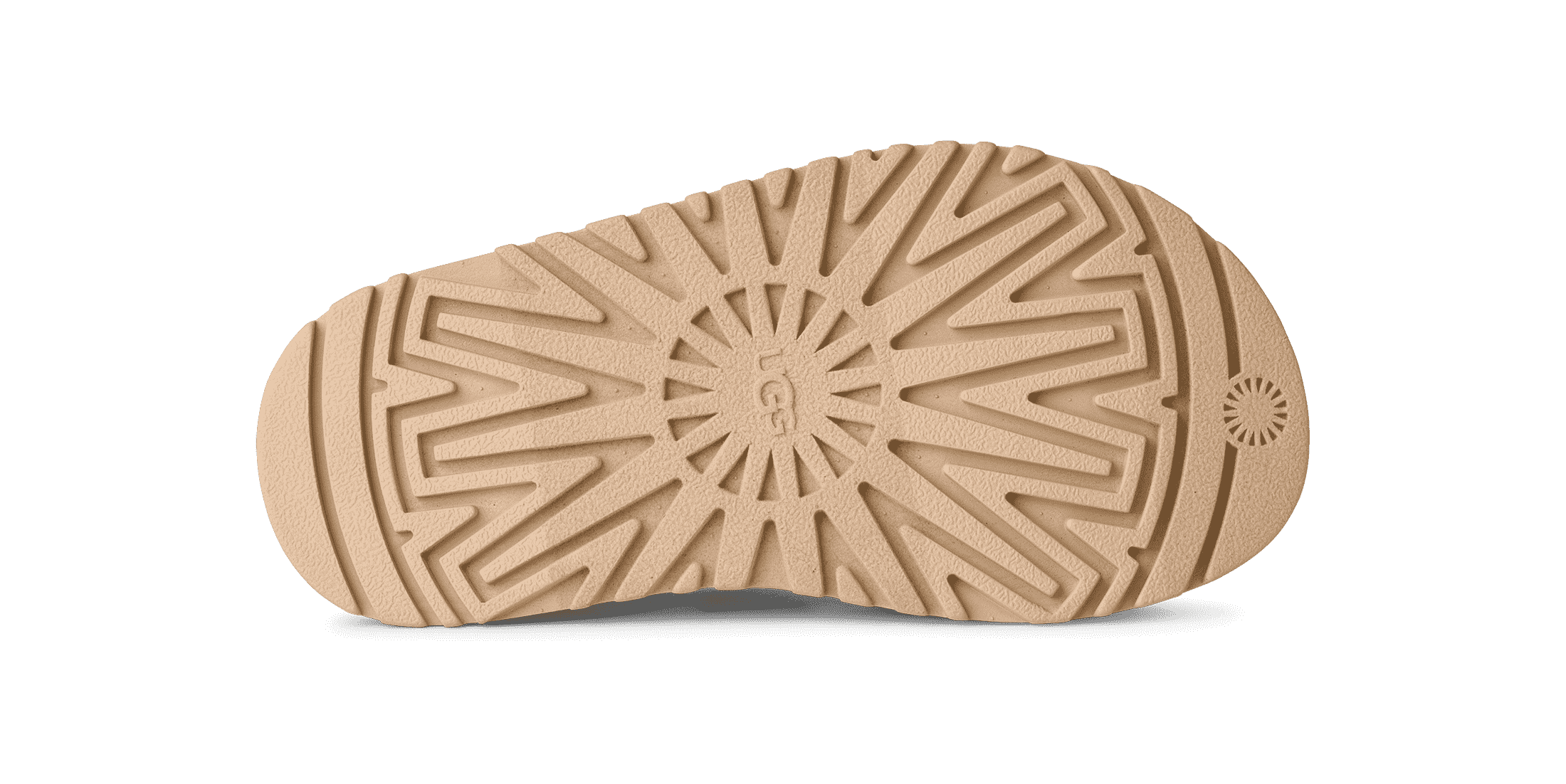 סוליית נעל גומי בז' עם דוגמה גיאומטרית ומיתוג UGG, צילום מוצר לאתר CHOZEN