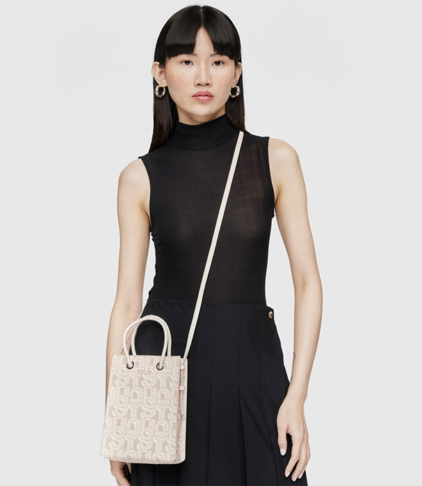 טואוס תיק יד מיני בצבע בז' מקולקציית MANIFESTO  לנשים