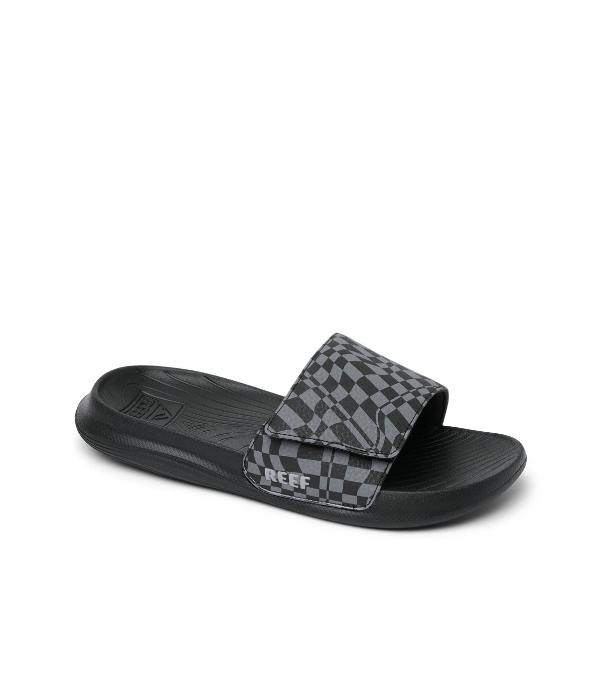 כפכף שחור לילדים עם רצועה משובצת בדוגמת שחמט ולוגו REEF בצד