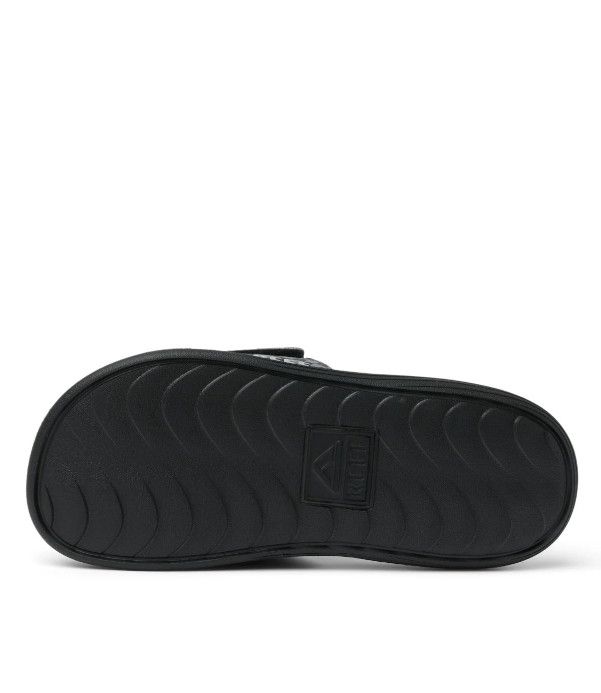 סוליית כפכף ילדים שחור עם טקסטורת גלים וסמל REEF במרכז