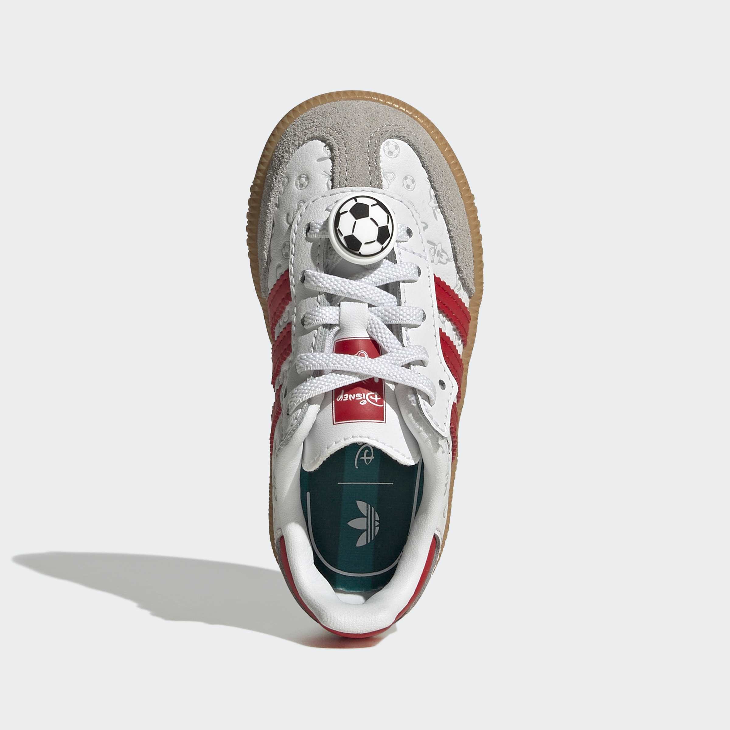 נעל ספורט לנוער בצבע לבן ואדום עם עיטור כדורגל, צילום מבט עליון